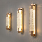 Three lengths of this Clérachic bubble-crystal wall light side by side on a grey wall, each glowing warmly.
