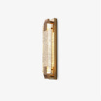 Side-on view of this Clérachic crystal wall light on white, showing the thin metal backplate and the bubbled glass bar.
