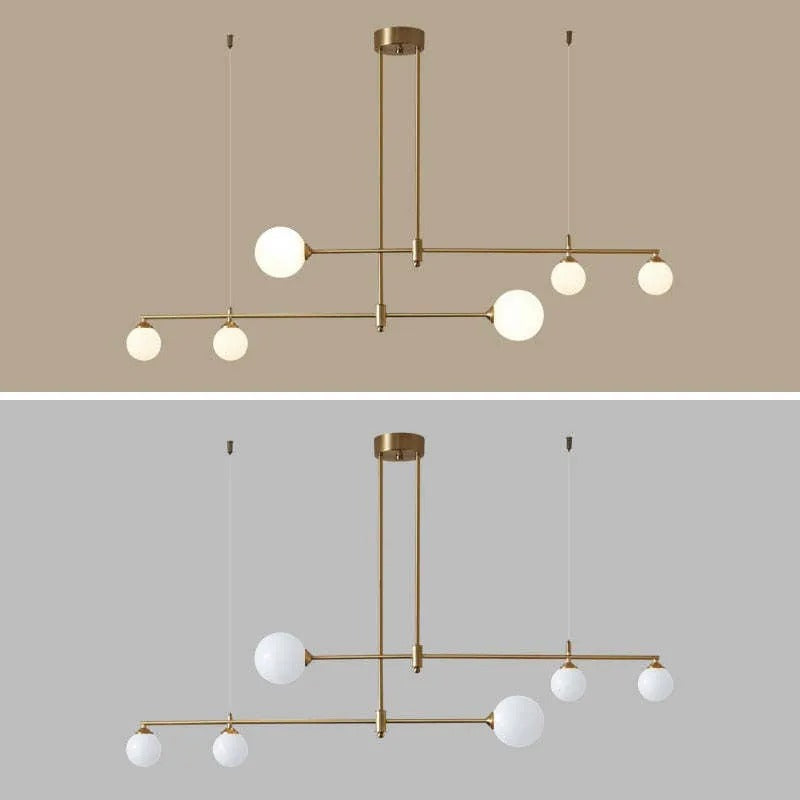 The Clérachic bubble-glass bar pendant shown in warm light and white light, the two bulb-colour options for its opal globes.