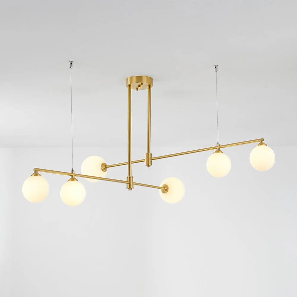 The Clérachic 6-head bubble-glass bar pendant on a plain background, its opal globes glowing warm across two staggered bars.