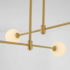Close-up of the Clérachic pendant's crossing bars, showing the suspension cables and opal globes at each arm's end.