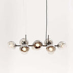 Black Clérachic bubble glass pendant with eight smoke gray glass globes, shown unlit against a plain white background.