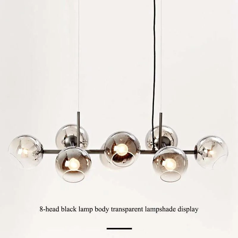 Studio display of the black-body Clérachic bubble glass pendant with all eight smoke gray globes lit.