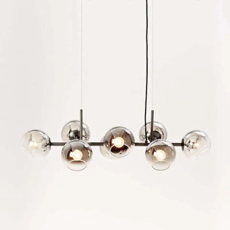 Black-body Clérachic bubble glass pendant with smoke gray globes, photographed on a seamless white studio backdrop.