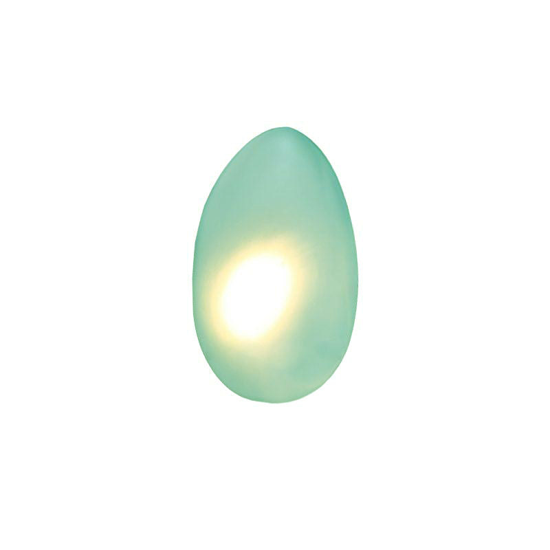 Clérachic Bubble Glass Wall Sconce in green, tall egg shape, with a bright warm hotspot sitting left of centre in the sea-green glass.