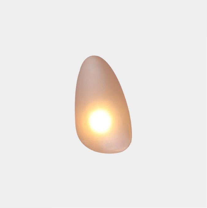 Amber Clérachic Bubble Glass Wall Sconce in the teardrop shape, a small bright point of warm light sitting low in the honey glass.