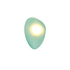 Green Clérachic Bubble Glass Wall Sconce in the rounded pebble shape, its warm centre sitting high and paling the sea-green glass.