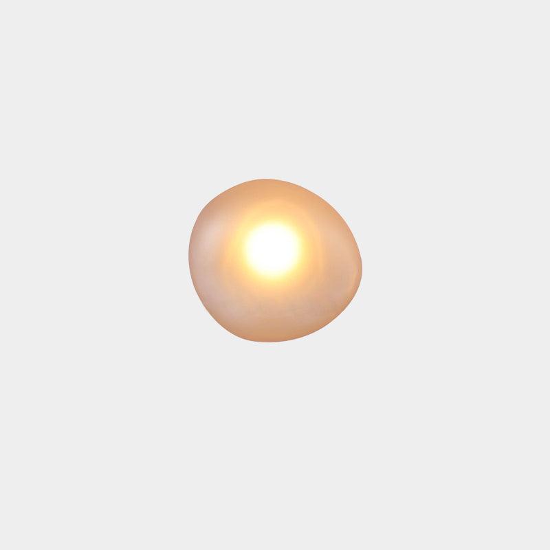 Clérachic Bubble Glass Wall Sconce in amber, squat round shape, with a bright warm centre fading to a honey rim at the edges.