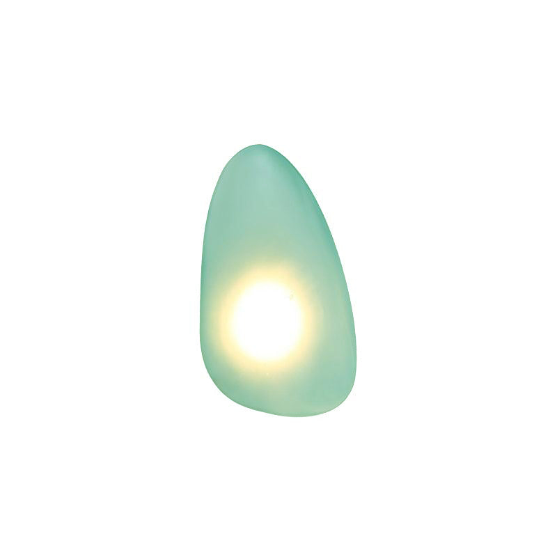 Clérachic Bubble Glass Wall Sconce in green, teardrop silhouette on white, warm light ringing the bulb inside the frosted glass.