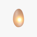 Clérachic Bubble Glass Wall Sconce in amber, tall egg shape shown large on white so the bubbled texture in the glass reads clearly.