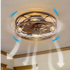 Clérachic caged ceiling fan with light on a room ceiling, with blue arrows and white airflow streams pointing downward.