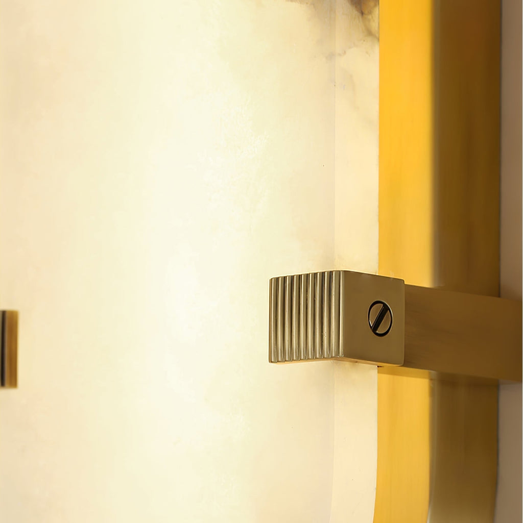 Close view of the Clérachic Calla brass channel with light spilling along the stone edge.