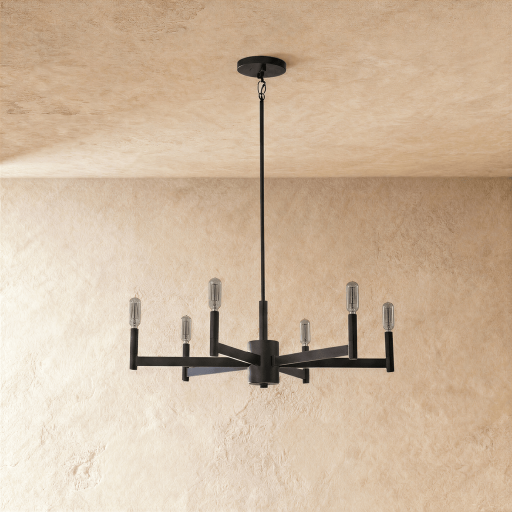 Clérachic six-arm black chandelier shown with the bulbs switched off, clear tubular lamps on square tubes, beneath a plaster ceiling.
