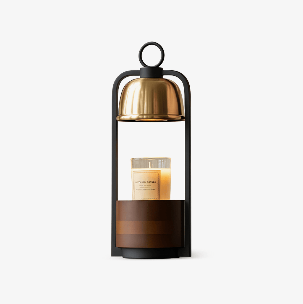 Candle warmer lamp from Clérachic with a brushed gold dome, black frame and walnut base, a jar candle sitting under the dome.