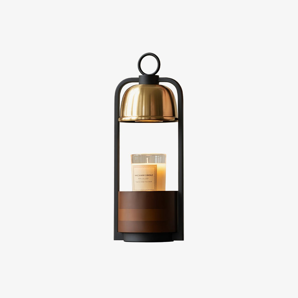 Clérachic candle warmer lamp with a gold dome and black loop handle above a walnut base, shown on a light backdrop.