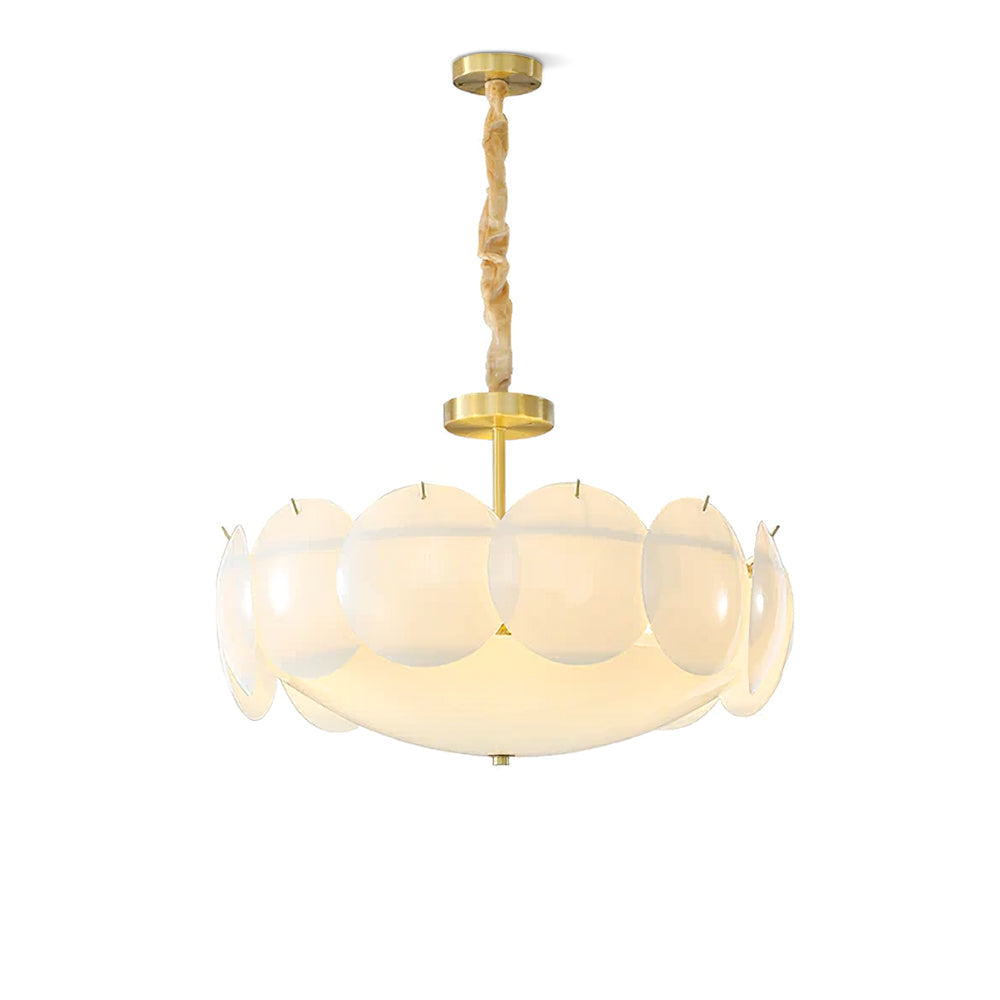 Clérachic chandelier in a front view on white, brass canopy, twisted chain and a ring of frosted shell shades lit from within.