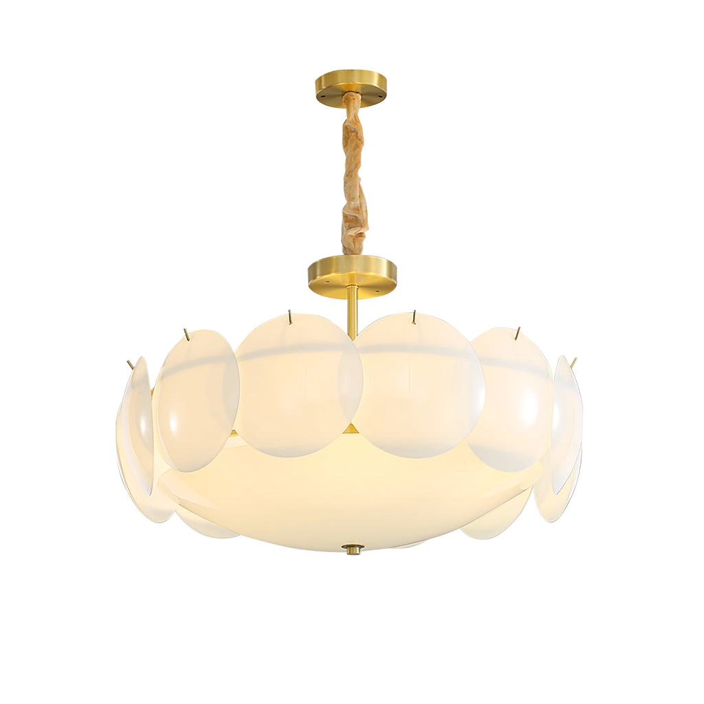 Clérachic chandelier lit on a white background, its ring of overlapping shell shades wide above a short brass stem.