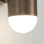 Close view of the frosted glass end and brushed brass rim of this Clérachic wall light.
