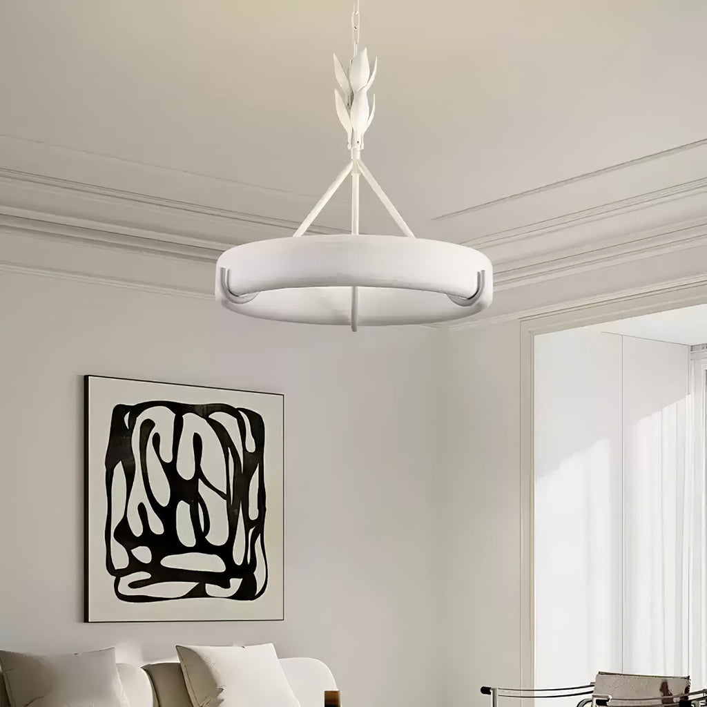 Our white ring chandelier hangs in a pale room with cornice mouldings and a black-and-white abstract print on the wall; a Clérachic ceiling light.