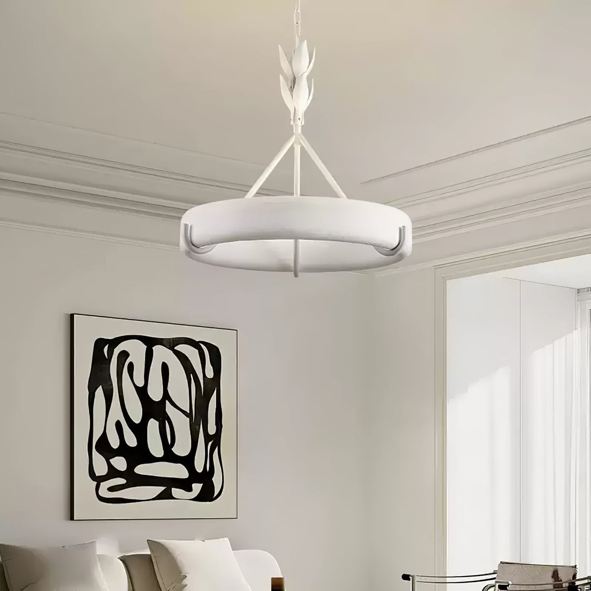 Our white ring chandelier hangs in a pale room with cornice mouldings and a black-and-white abstract print on the wall; a Clérachic ceiling light.