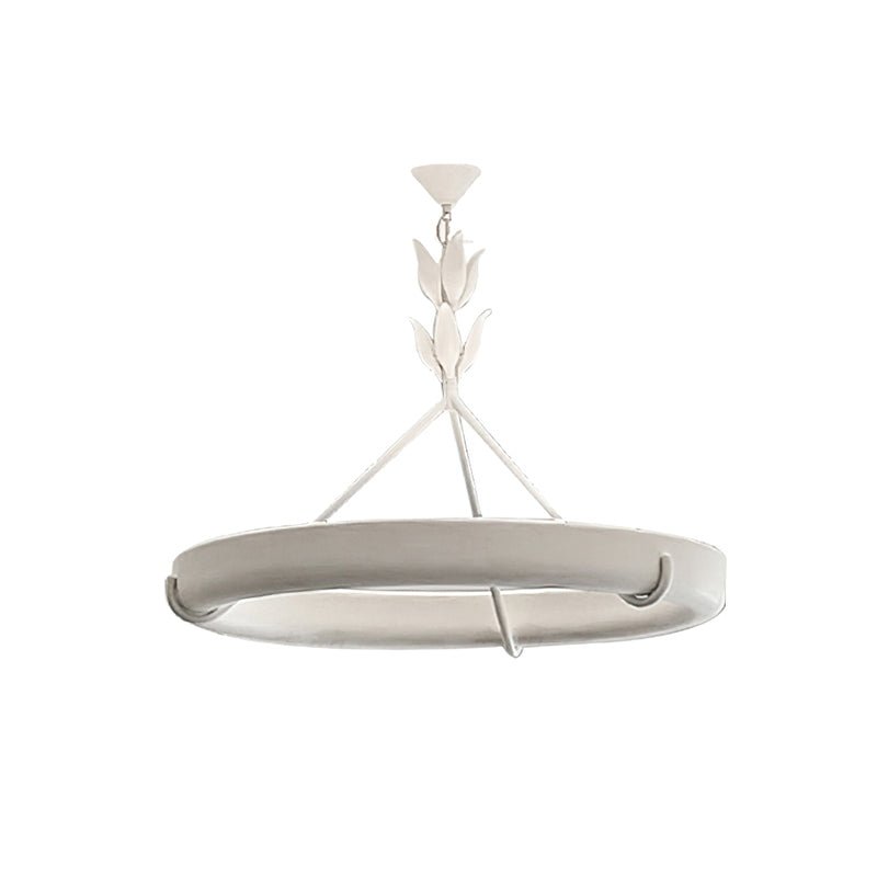 Flatter angle on the white ring, with its leaf-bud stem and conical ceiling cap, on a white backdrop; a Clérachic chandelier.