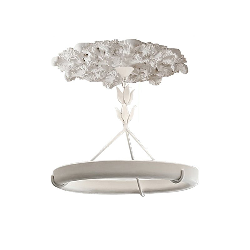 Studio view of the white ring beneath its large plaster rose, with the three rods and hooks visible; a Clérachic chandelier.