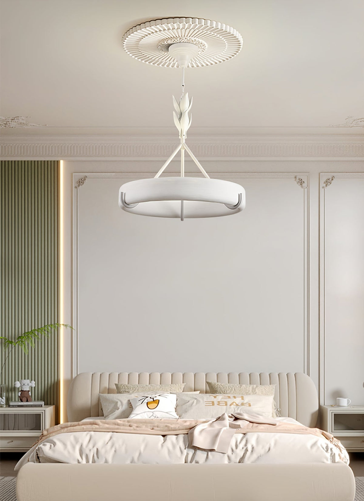 Above a bed with a cream headboard in a green and white panelled room, this Clérachic chandelier hangs from a ribbed ceiling rose.