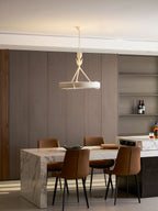 The white ring hangs before open shelves and a marble table with leather chairs, seen from further back; a Clérachic chandelier.