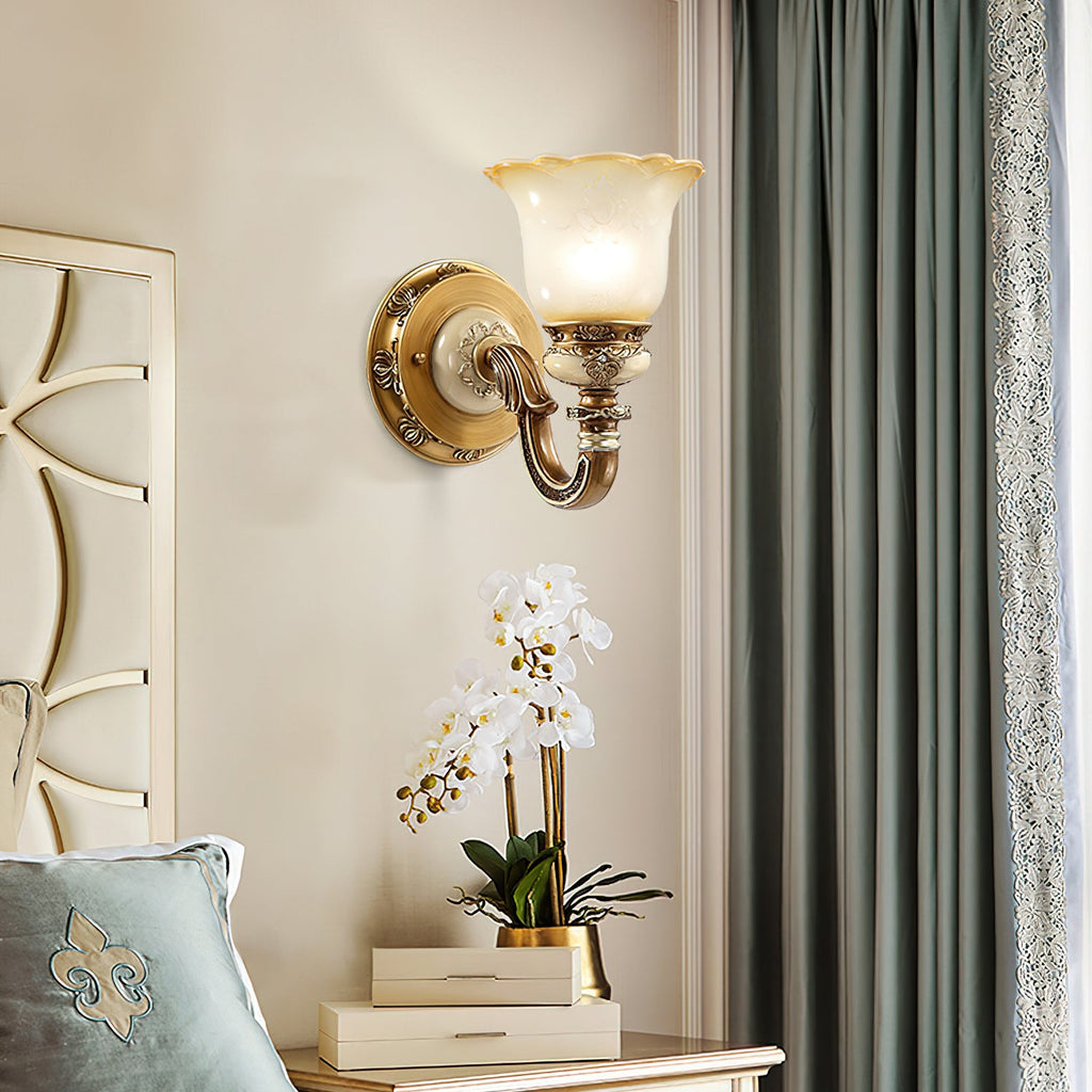 Single-head Clérachic wall light on a cream wall above a white orchid, with sage-green curtains at the right.
