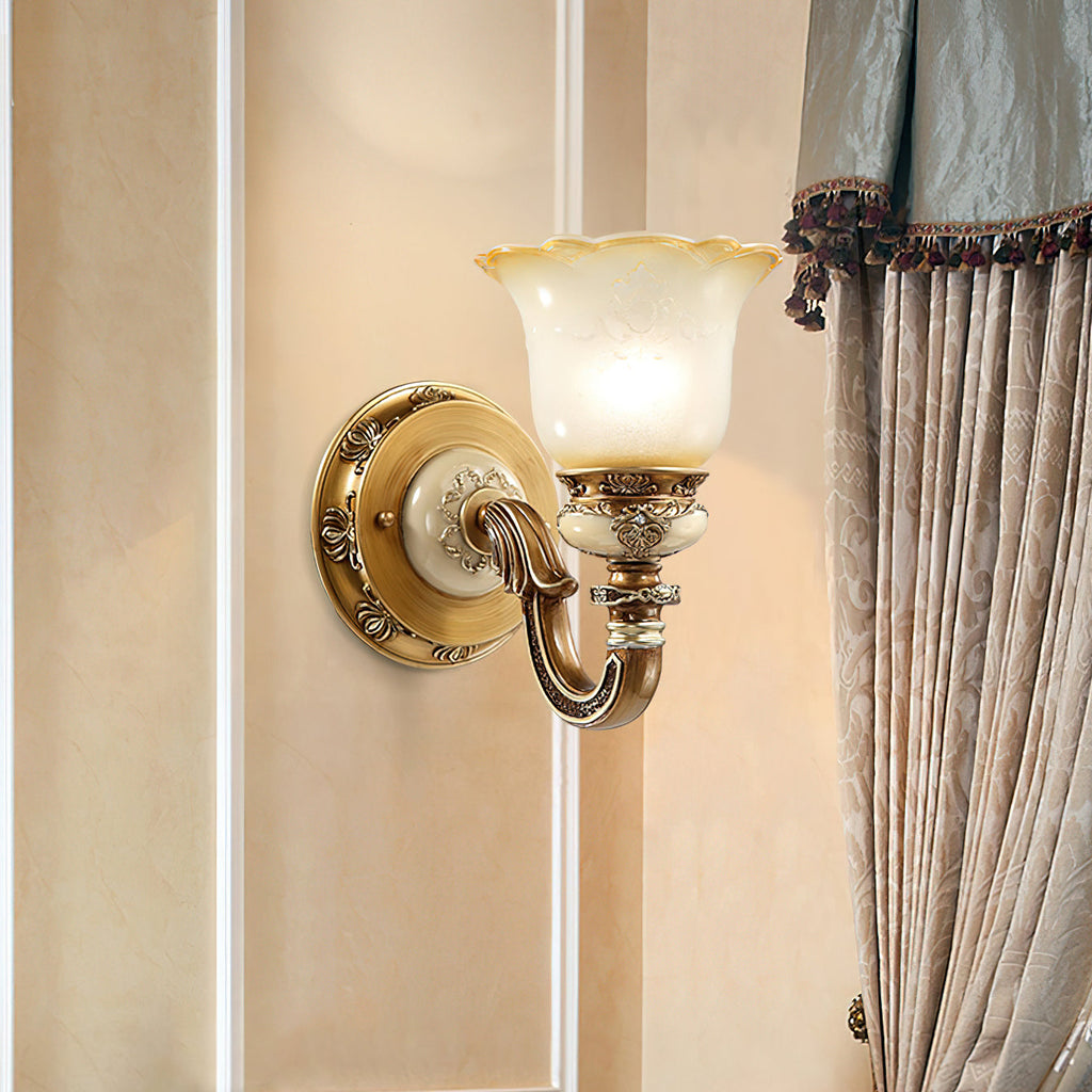 Lit single-head Clérachic wall light on a warm cream wall, beside a draped curtain with a beaded trim.