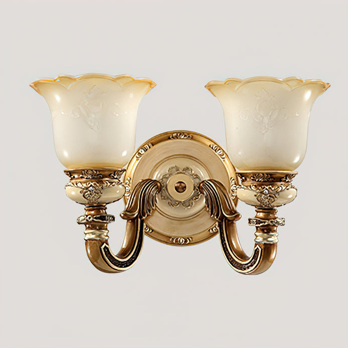 Double-head Clérachic wall light on a pale grey backdrop, two frosted shades above carved gold arms and a round backplate.