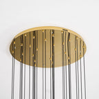 The gold canopy of the Clérachic Cascading Globe Chandelier from below, each brass cord-lock setting one flex to its own length.