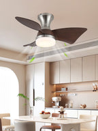 The same Clérachic nickel ceiling fan from another angle, with green arrows showing airflow above a dining table and a pale kitchen.