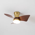 A Clérachic gold ceiling fan with walnut-grain blades and a bright warm light, shown from below against a pale grey ceiling.