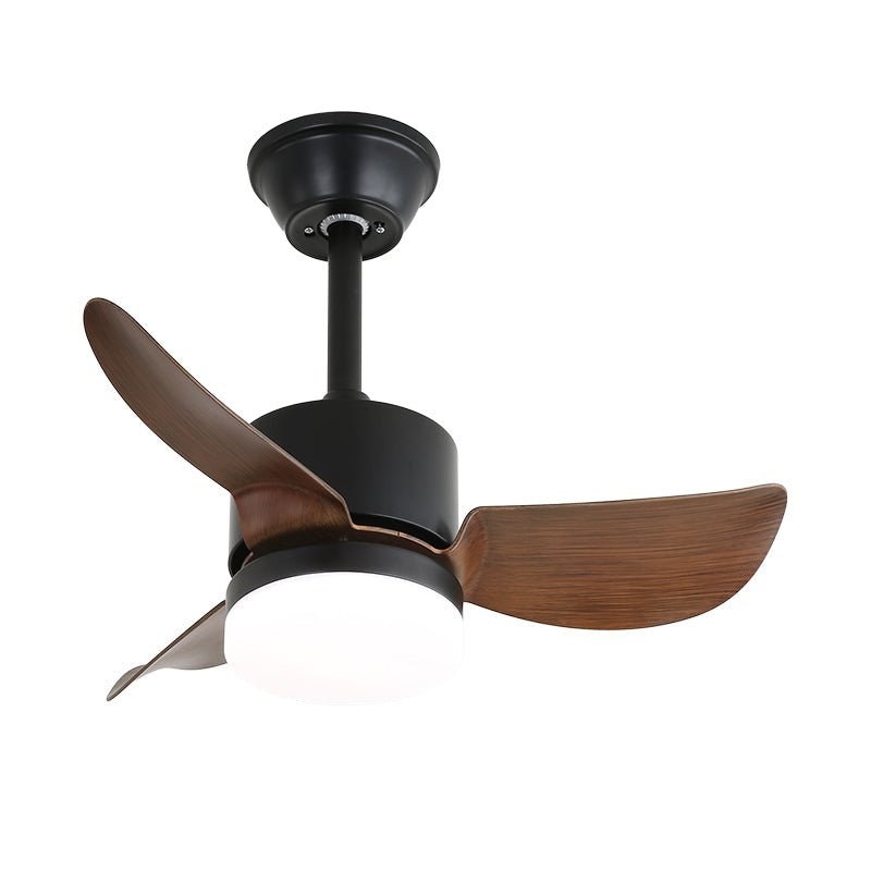 Clérachic fan with a black motor housing and three wide walnut-effect blades, with the white light lit below, on white.