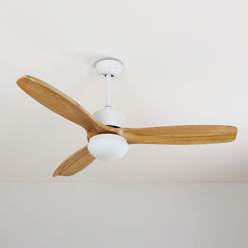 White ceiling fan from Clérachic with natural wooden blades, shown unlit and close to a white ceiling edge.