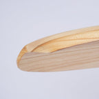 Close view of the rounded tip of a light wooden blade on this Clérachic ceiling fan, showing its fine grain.