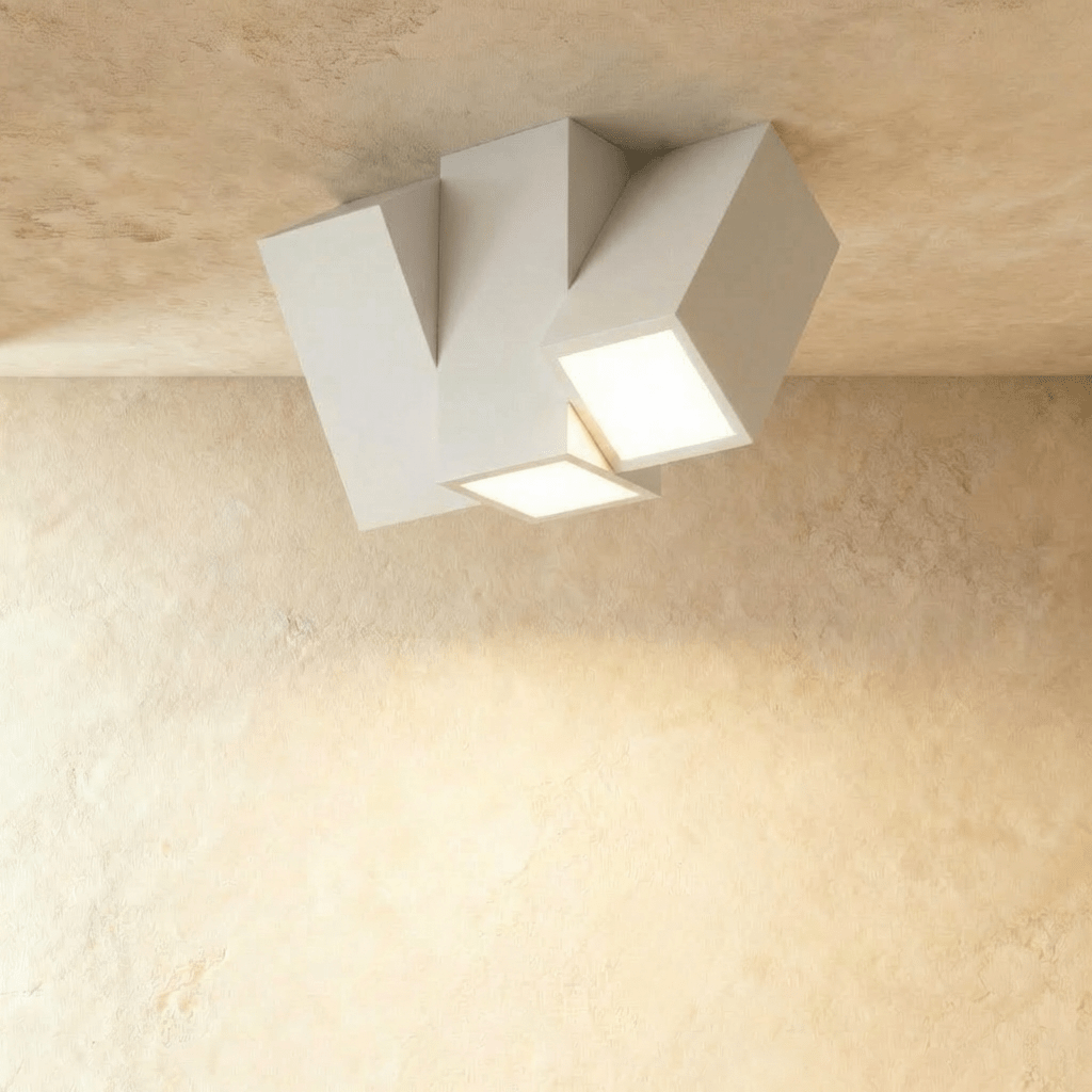Clérachic white three-head square-section ceiling light, two faces glowing, set on a limewashed ceiling