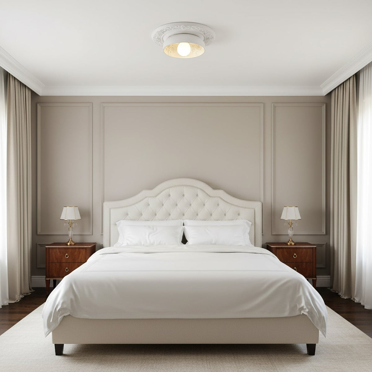 Clérachic white bowl light on a small plaster ceiling rose above a tufted cream bed and two lamps in a panelled bedroom.