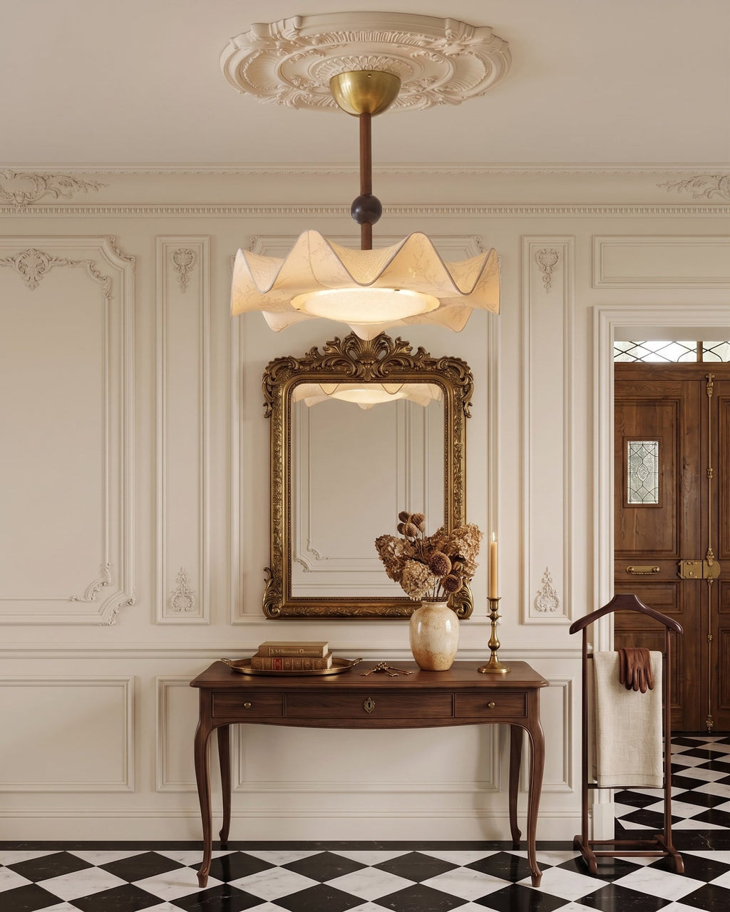 This Clérachic ceiling light hangs in a hallway above a carved console table and a gilt mirror, with a black-and-white tiled floor.