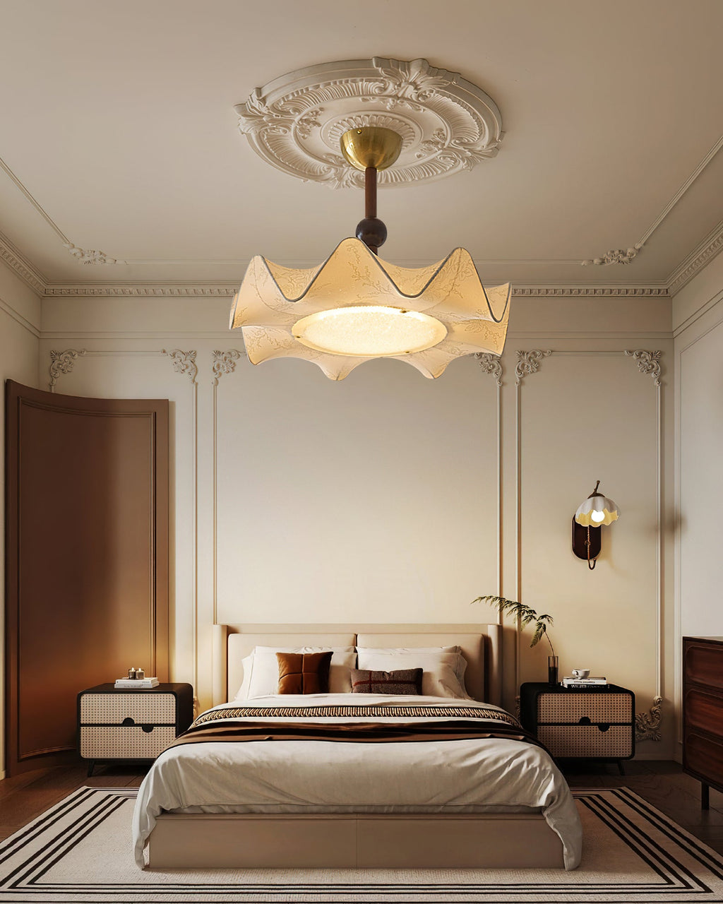 This Clérachic ceiling light hangs under a plaster ceiling rose, above a bed with striped rug and two cream bedside tables.