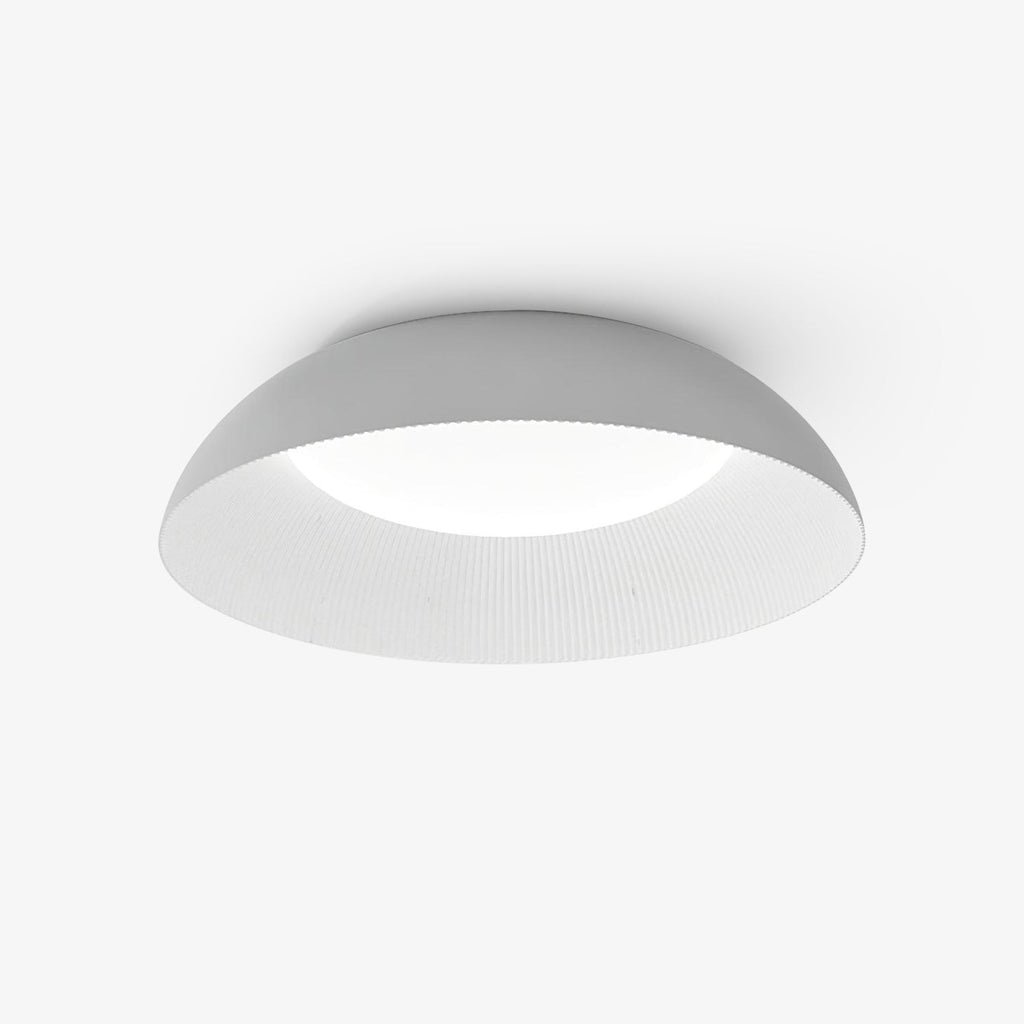Low domed ceiling light with a pale grey outer shell and a white ribbed inner rim, from Clérachic, on a plain white backdrop.