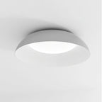 Close view of the grey dome and finely ribbed white interior of this Clérachic ceiling light, with its LED diffuser glowing.
