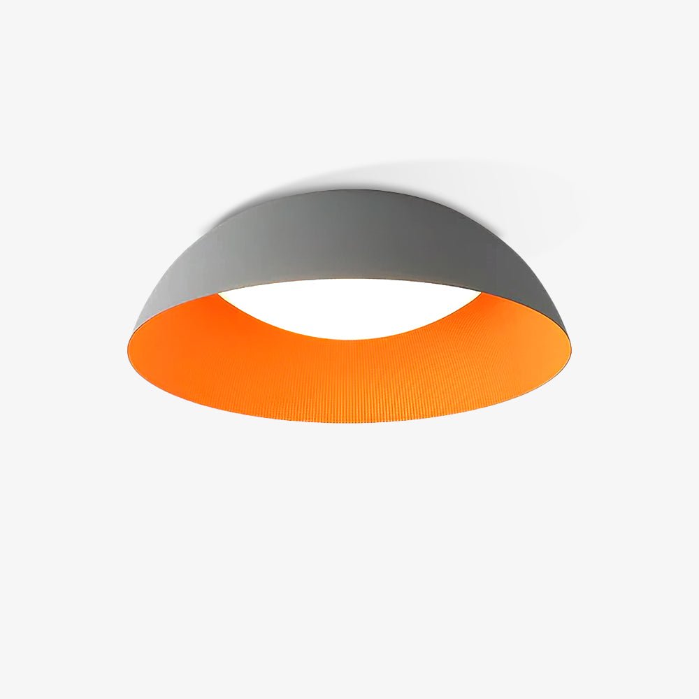 Grey and orange low dome ceiling light from Clérachic, angled to show the ribbed orange inside and the white diffuser.