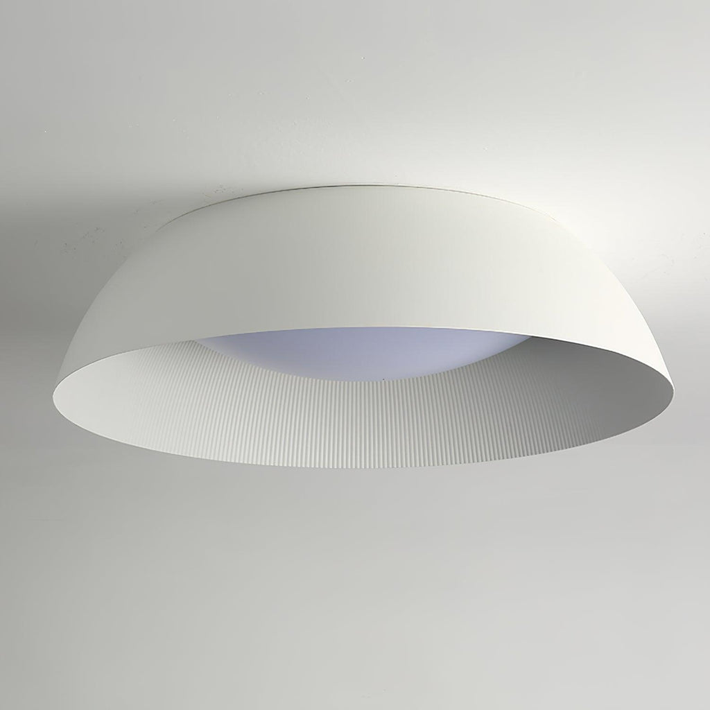 Large white dome ceiling light from Clérachic seen from a low angle, showing the fine ribbing and a slightly blue-white diffuser.