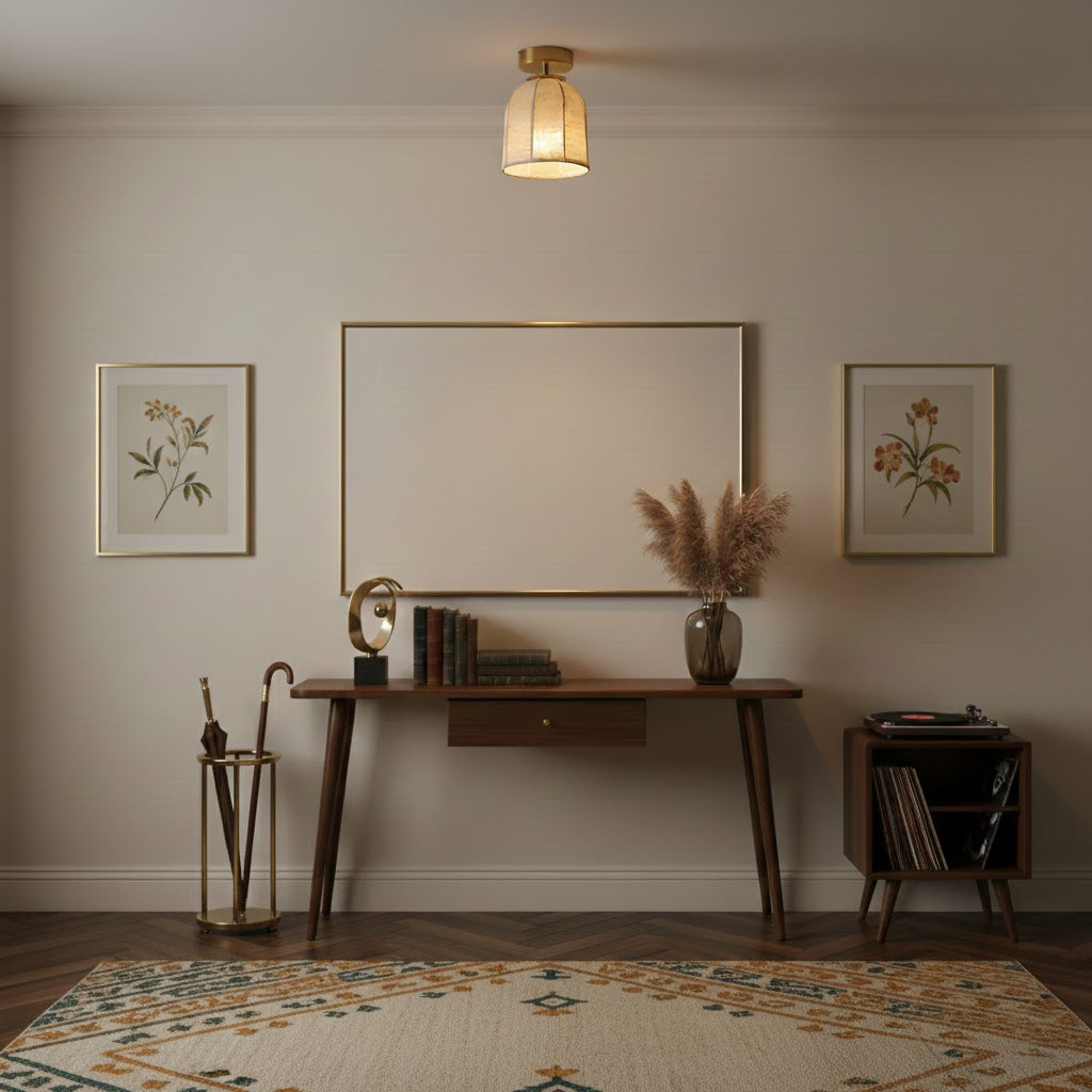 A Clérachic ceiling light with a linen shade above a dark wooden console table, framed botanical prints and a patterned rug.