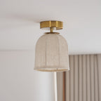 The Clérachic linen-shade ceiling light switched off, showing the pale woven fabric, ribs and gold canopy against a white ceiling.