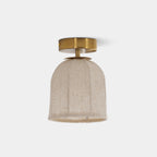 Clérachic ceiling light with a pale linen shade and a gold canopy, shown unlit against a light grey backdrop.