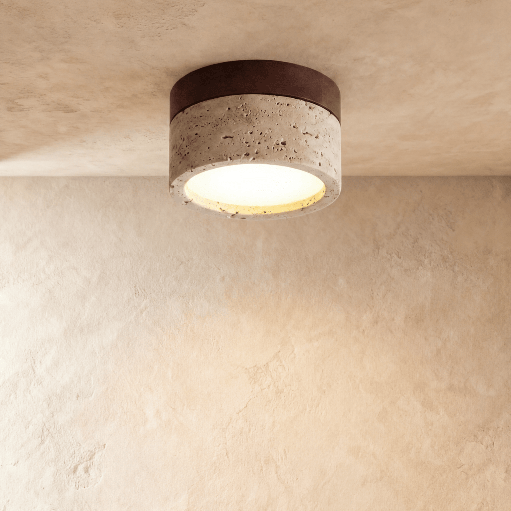 Clérachic ceiling light with a dark walnut band over a speckled travertine-look drum, mounted flush overhead.