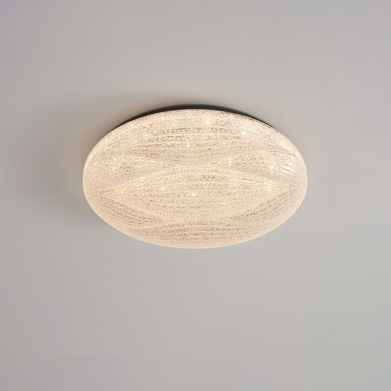 Unlit, this Clérachic ceiling light shows a black rim and a clear, crystal-textured shade on a grey ceiling.